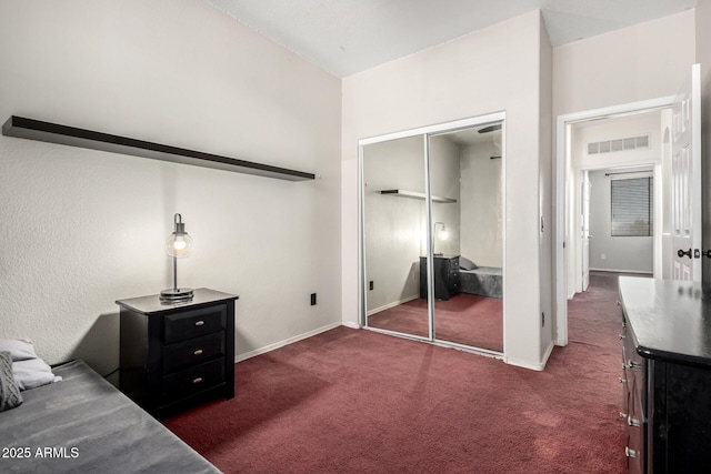 6505 S 15th Dr, Phoenix, AZ 85041 - unfurnished bedroom featuring dark colored carpet, a closet, and baseboards