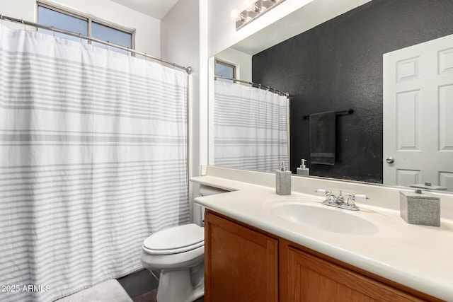 6505 S 15th Dr, Phoenix, AZ 85041 - full bath featuring toilet, vanity, a textured wall, and tile patterned floors