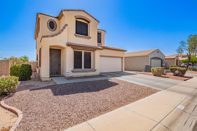 6505 S 15th Dr, Phoenix, AZ 85041 - mediterranean / spanish-style home with driveway, stucco siding, and fence