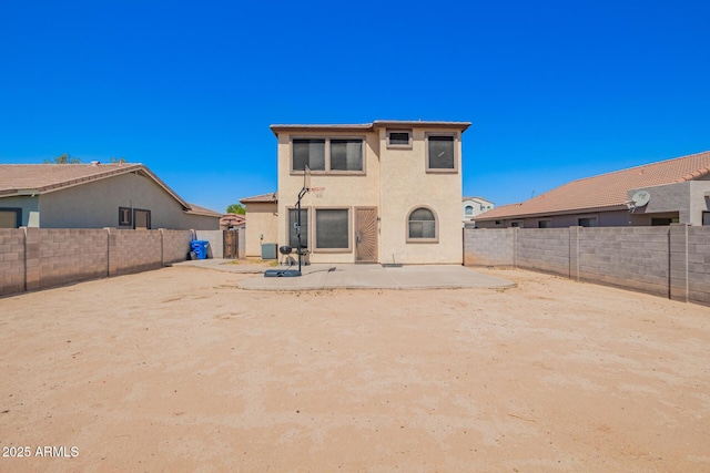 6505 S 15th Dr, Phoenix, AZ 85041 - rear view of house featuring a patio area, a fenced backyard, and stucco siding