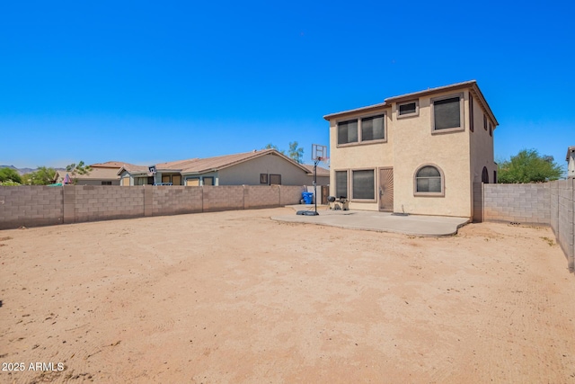 6505 S 15th Dr, Phoenix, AZ 85041 - back of house with a patio, a fenced backyard, and stucco siding