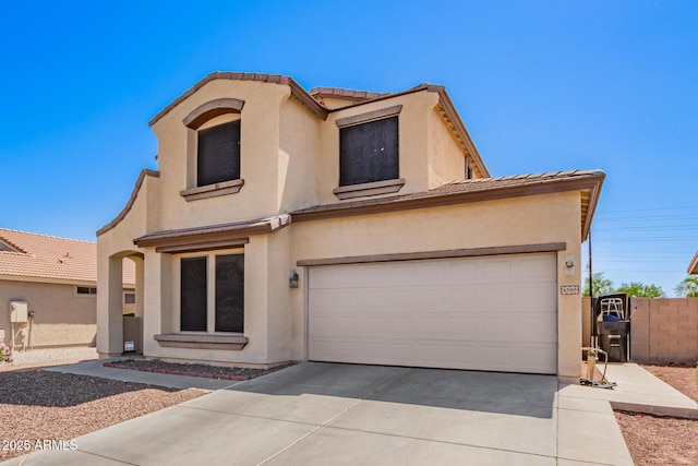6505 S 15th Dr, Phoenix, AZ 85041 - view of front of house featuring stucco siding, concrete driveway, a tile roof, fence, and a garage