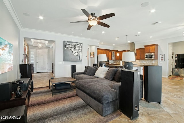 living room featuring ceiling fan, ornamental molding, and recessed lighting