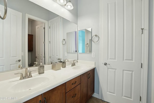 bathroom with double vanity and a sink