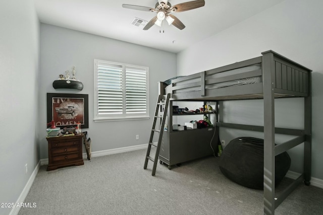 carpeted bedroom featuring visible vents, baseboards, and a ceiling fan