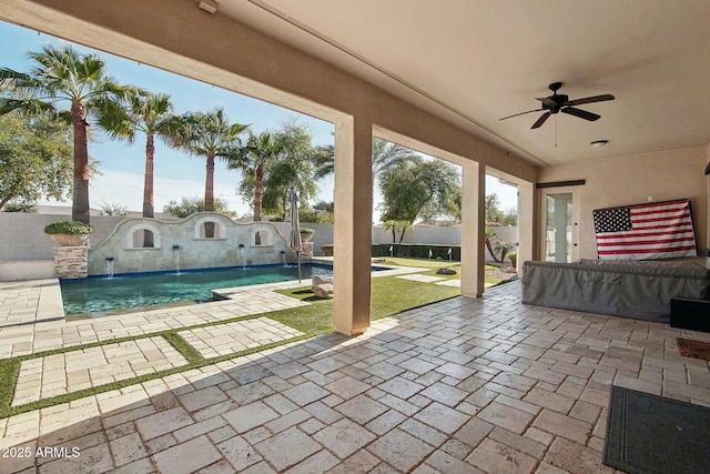 view of patio with a fenced backyard, a fenced in pool, and a ceiling fan