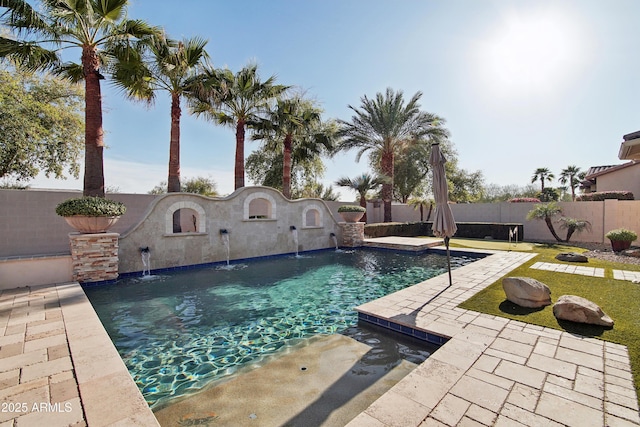 view of swimming pool with a fenced in pool, a fenced backyard, and a patio