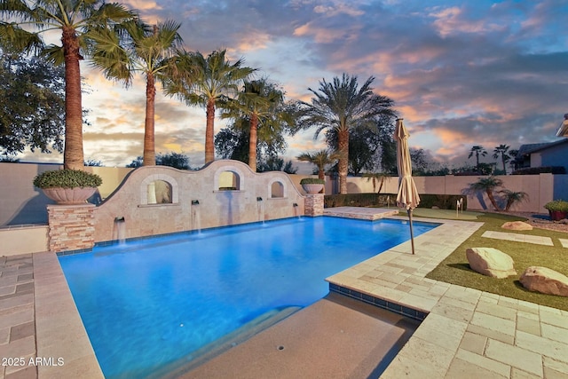 view of swimming pool featuring a patio area, a fenced backyard, and a fenced in pool