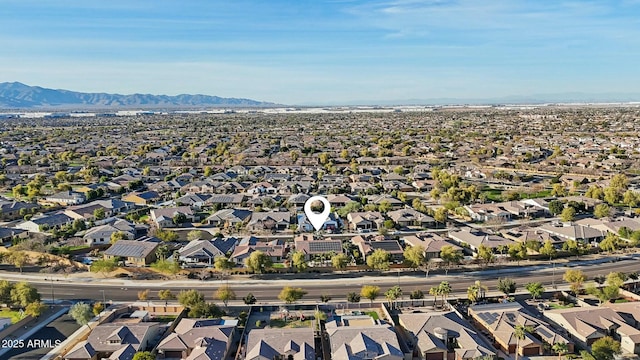 birds eye view of property with a residential view and a mountain view