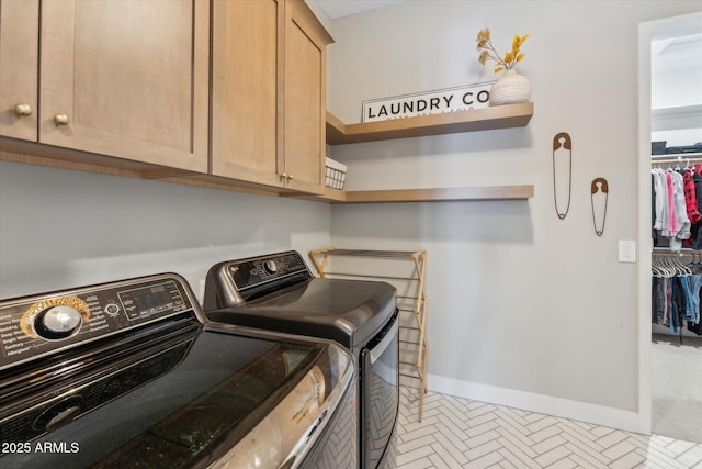 21391 W Mariposa St, Buckeye, AZ 85396 - washroom featuring washer and dryer, baseboards, and cabinet space