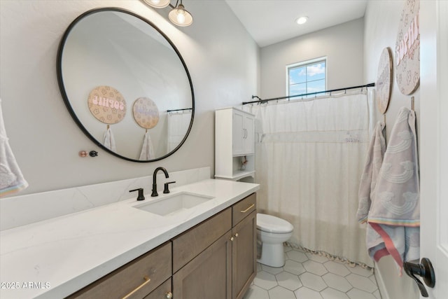 21391 W Mariposa St, Buckeye, AZ 85396 - full bathroom featuring toilet, vanity, tile patterned flooring, and recessed lighting