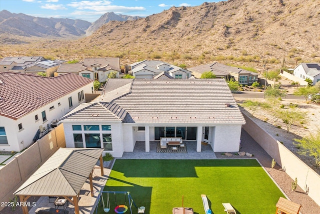 21391 W Mariposa St, Buckeye, AZ 85396 - back of property with stucco siding, a residential view, and a mountain view