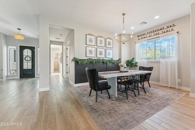 21391 W Mariposa St, Buckeye, AZ 85396 - dining area featuring a chandelier, wood finished floors, baseboards, and recessed lighting