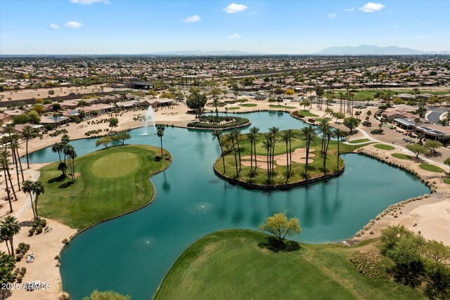 aerial view with golf course view, a residential view, and a water and mountain view