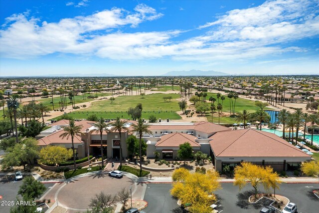 aerial view featuring a residential view, a mountain view, and view of golf course