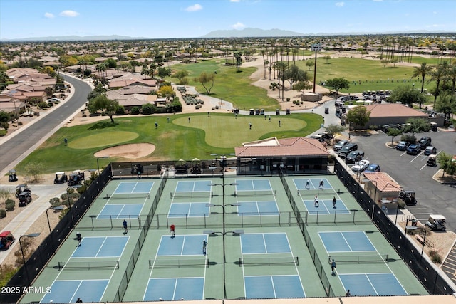 bird's eye view featuring a mountain view and golf course view