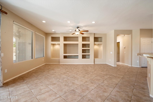 unfurnished living room featuring recessed lighting, light tile patterned floors, ceiling fan, built in features, and baseboards