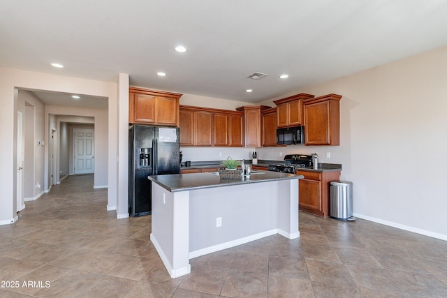 kitchen with a center island, sink, and black appliances