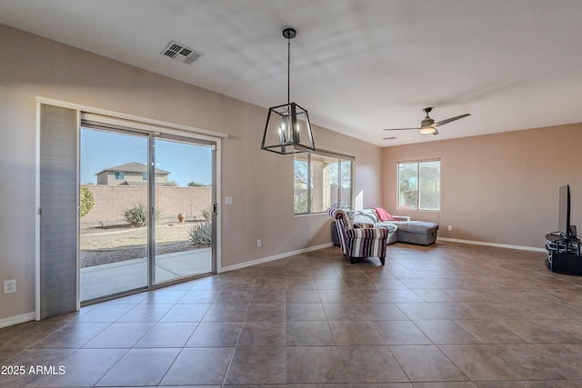 interior space featuring tile patterned floors and ceiling fan