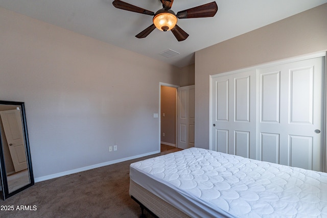 unfurnished bedroom with dark carpet, a closet, and ceiling fan