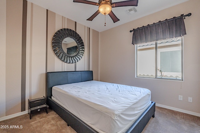 bedroom with light carpet and ceiling fan