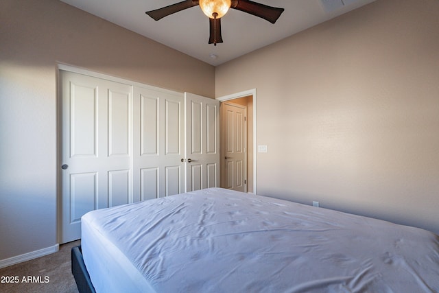 bedroom featuring carpet flooring, ceiling fan, and a closet