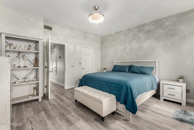 5015 E Cheyenne Dr Unit 31, Phoenix, AZ 85044 - bedroom featuring baseboards, wood finished floors, and visible vents