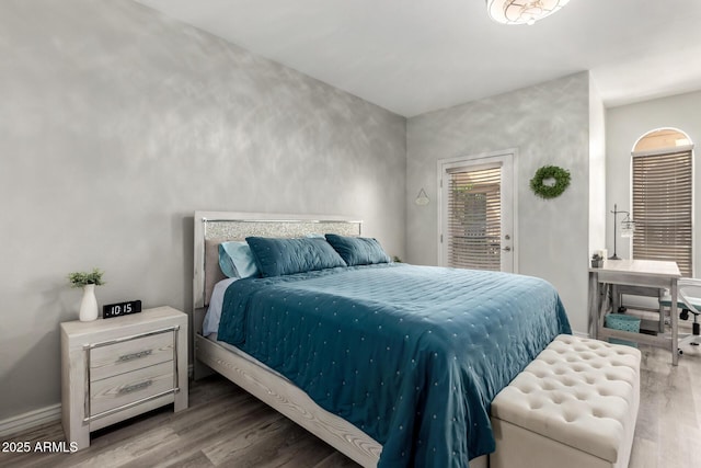 bedroom featuring wood finished floors