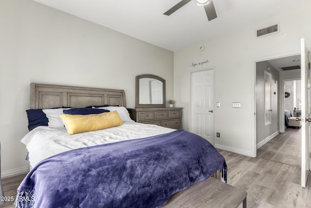 bedroom with visible vents, baseboards, and light wood-type flooring