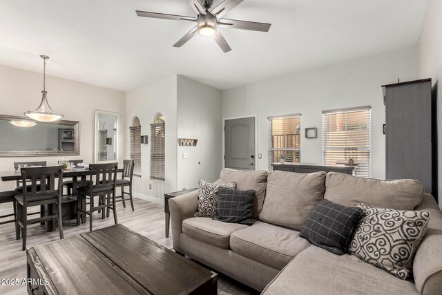 5015 E Cheyenne Dr Unit 31, Phoenix, AZ 85044 - living area featuring baseboards, light wood finished floors, and ceiling fan