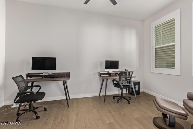 office space with a ceiling fan, baseboards, and wood finished floors