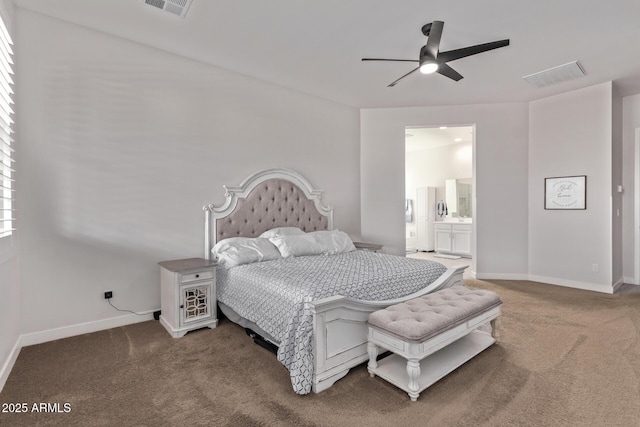 bedroom featuring carpet flooring, connected bathroom, visible vents, and baseboards