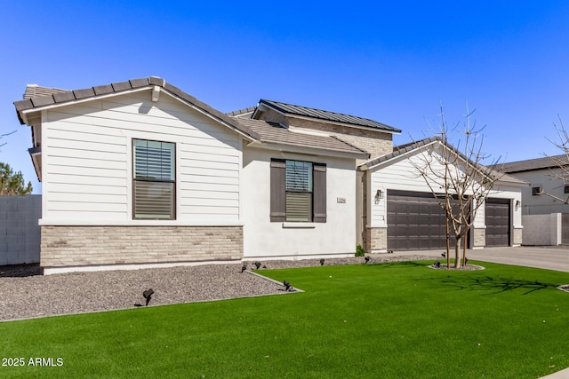 ranch-style home featuring driveway, a garage, fence, a front lawn, and brick siding