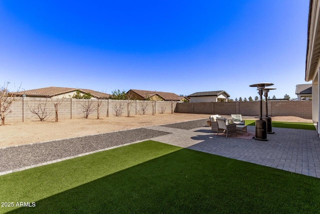 view of yard with an outdoor hangout area, a patio area, and a fenced backyard