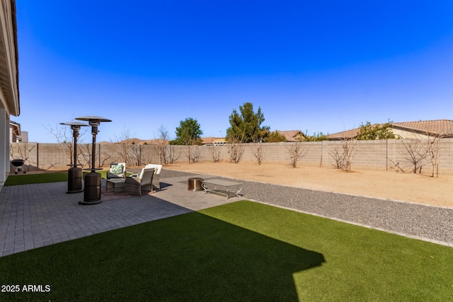 view of yard featuring a fenced backyard and a patio