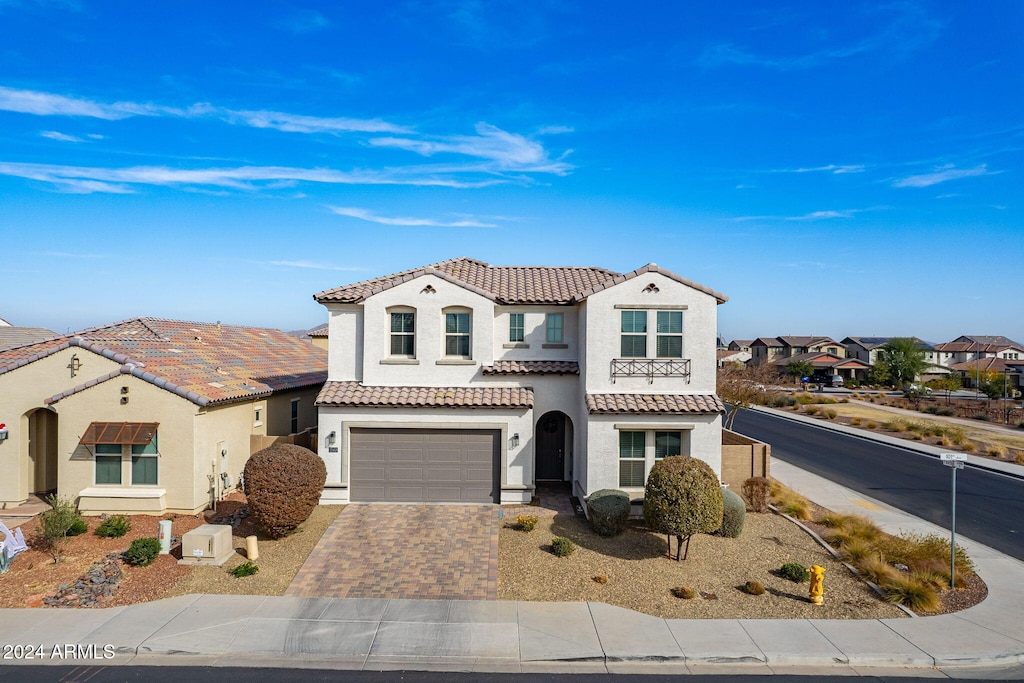 mediterranean / spanish-style house featuring a garage