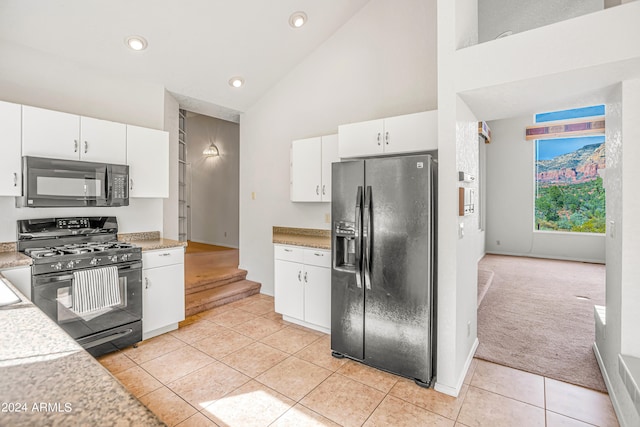 kitchen featuring black appliances, white cabinetry, and light tile patterned floors