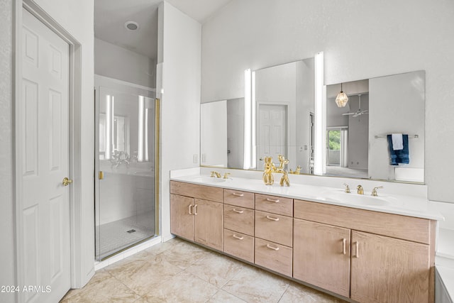 bathroom featuring an enclosed shower, tile patterned floors, and vanity