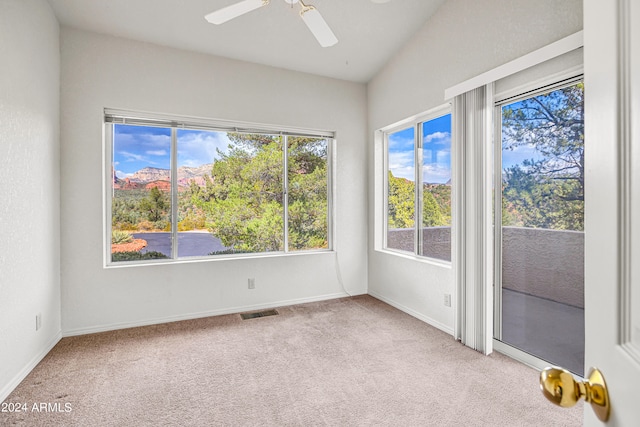 spare room featuring ceiling fan and light colored carpet