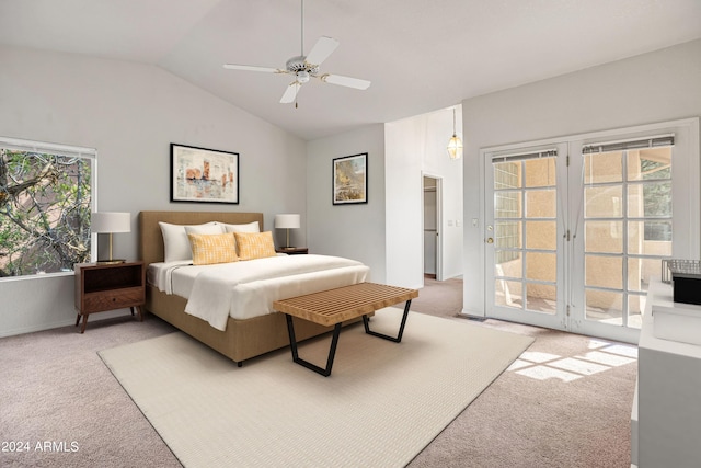 carpeted bedroom featuring lofted ceiling, access to exterior, multiple windows, and ceiling fan