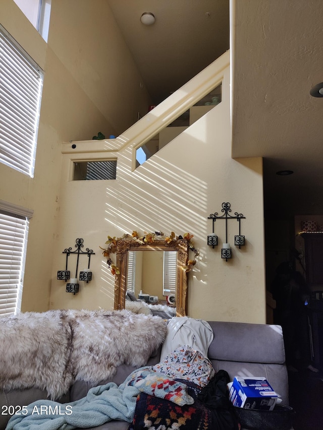 living room with a towering ceiling