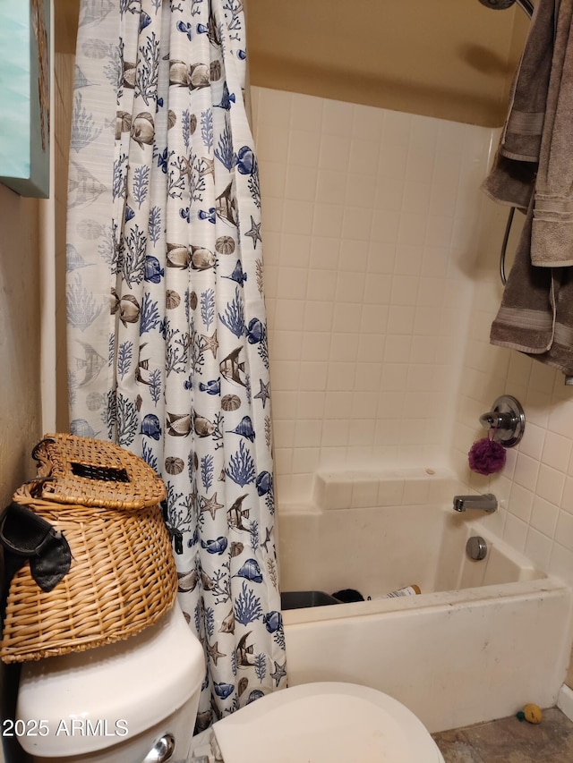 bathroom with toilet and shower / bath combo with shower curtain