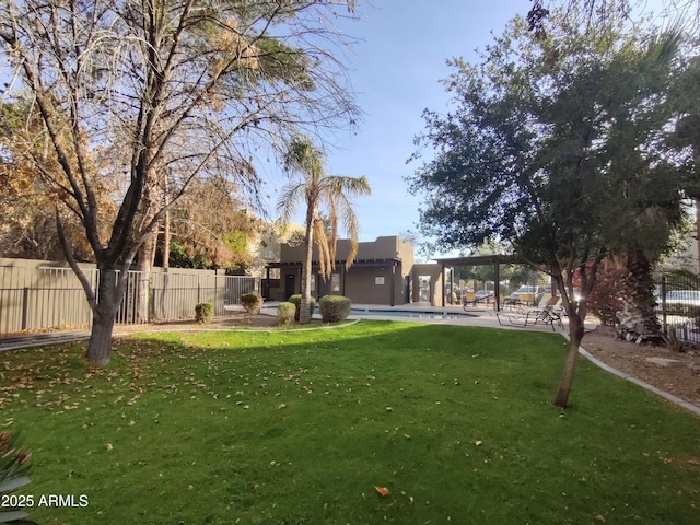 view of yard with a community pool and a patio