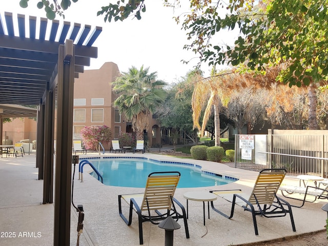 view of swimming pool with a pergola and a patio