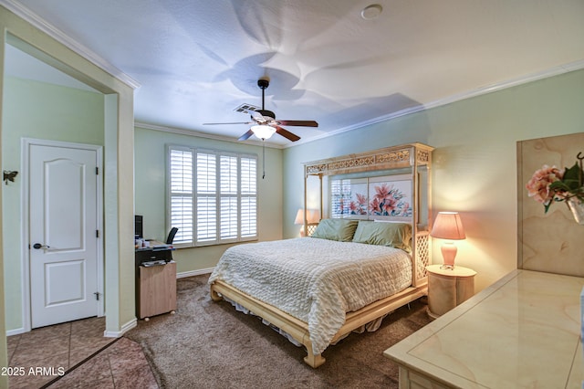 tiled bedroom with ornamental molding, visible vents, baseboards, and a ceiling fan