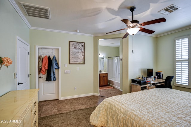 bedroom featuring baseboards, dark tile patterned flooring, visible vents, and crown molding