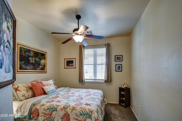 carpeted bedroom featuring visible vents, baseboards, and a ceiling fan