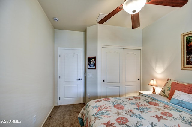 bedroom with a closet, carpet, a ceiling fan, and baseboards