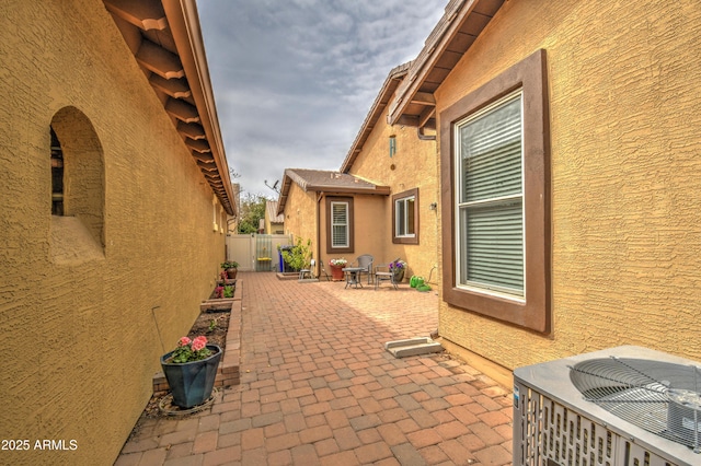 view of patio / terrace featuring a fenced backyard and central air condition unit