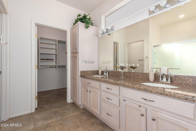 bathroom featuring vanity and walk in shower